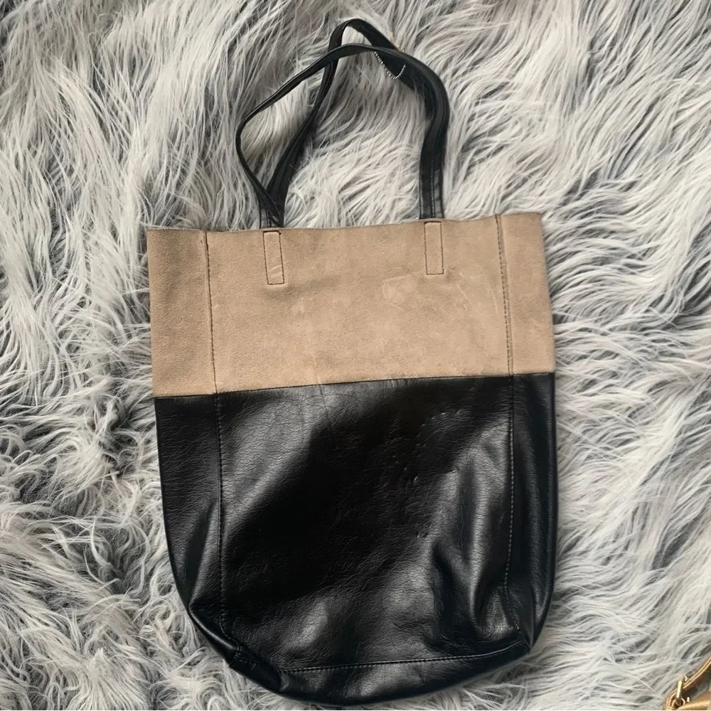 Soft, color-block Shopper Tote with concealed magnetic fastener at top. Unlined.